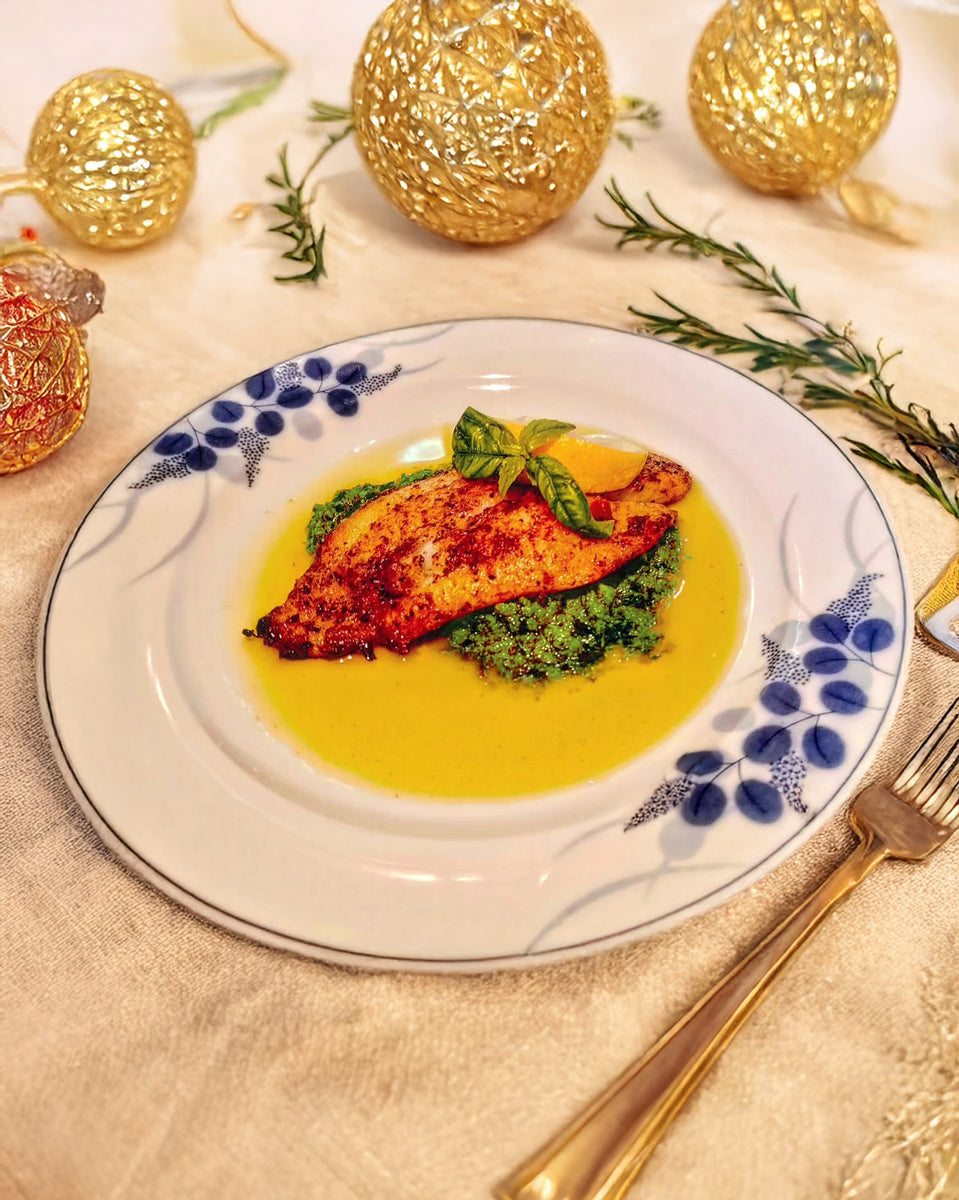 Fillet fish served on a bed of pesto sauce