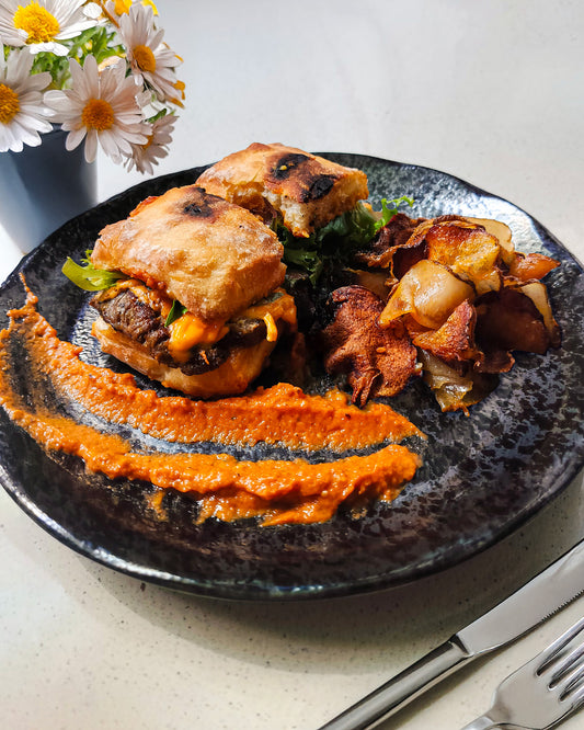 Roasted steak sandwich with homemade potato chips and tomato sauce