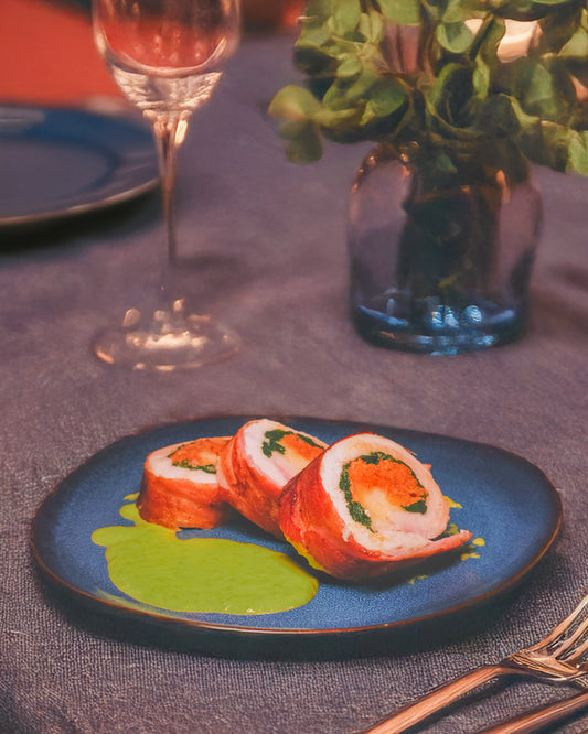 Chicken roulade wrapped in parma ham and served with mint & pea sauce