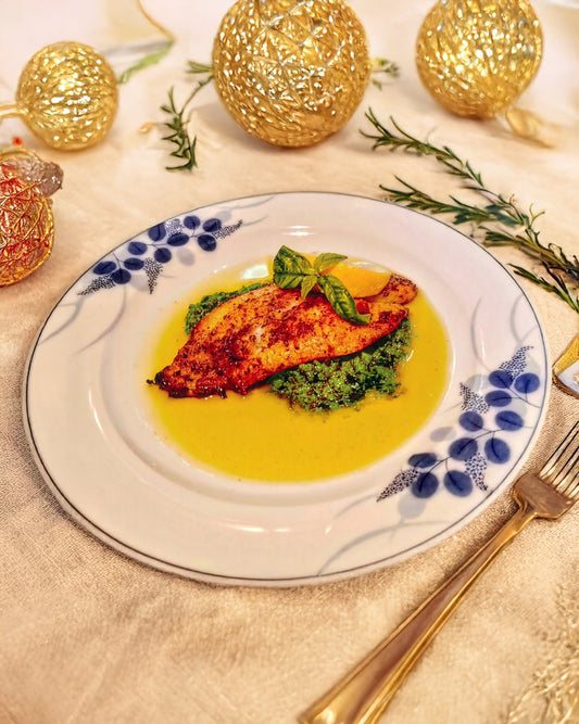 Fillet fish served on a bed of pesto sauce